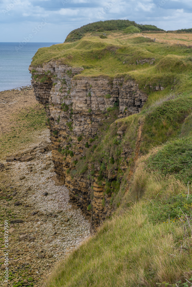 Fototapeta premium Pointe-Du-Hoc, France - 08 11 2019: Walk on the Pointe Du Hoc trail