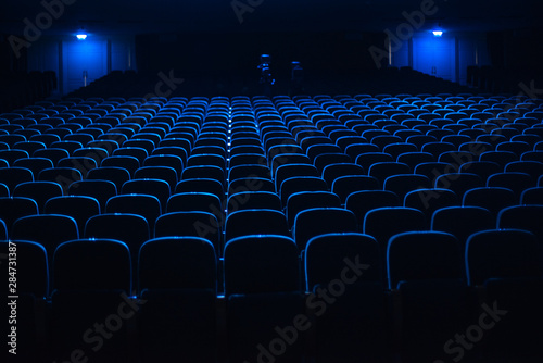 empty auditorium with seats photo
