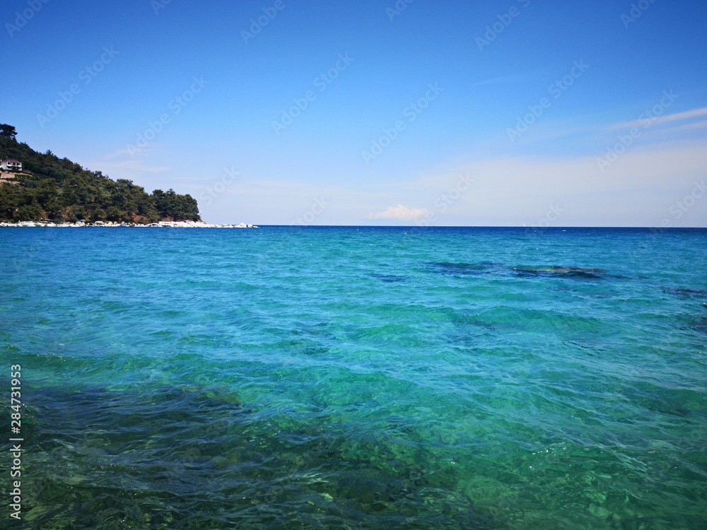 Exotic beach with green, emerald water color