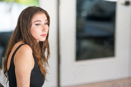 Woman looking away from camera in deep thought Free Download Woman looking away from camera in deep thought - GFXLoad