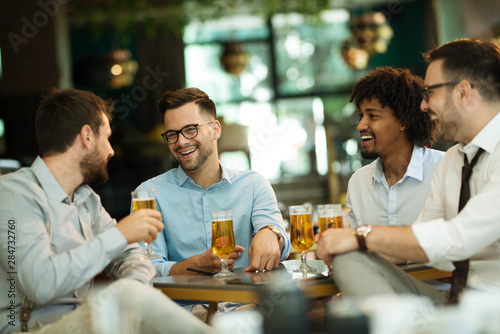 Business people enjoy and work in a cafe and drink beer