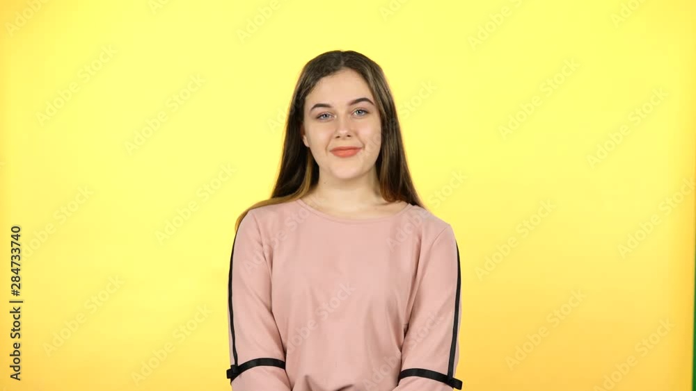 Portrait of wonderful pubescent on yellow background