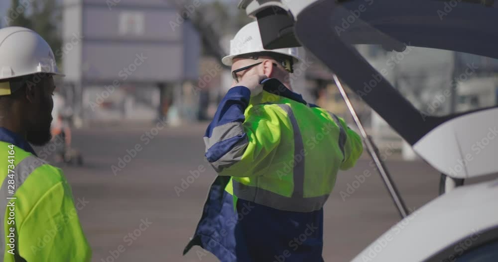 Caucasian and african engineers going to work Caucasian and african engineers going to work