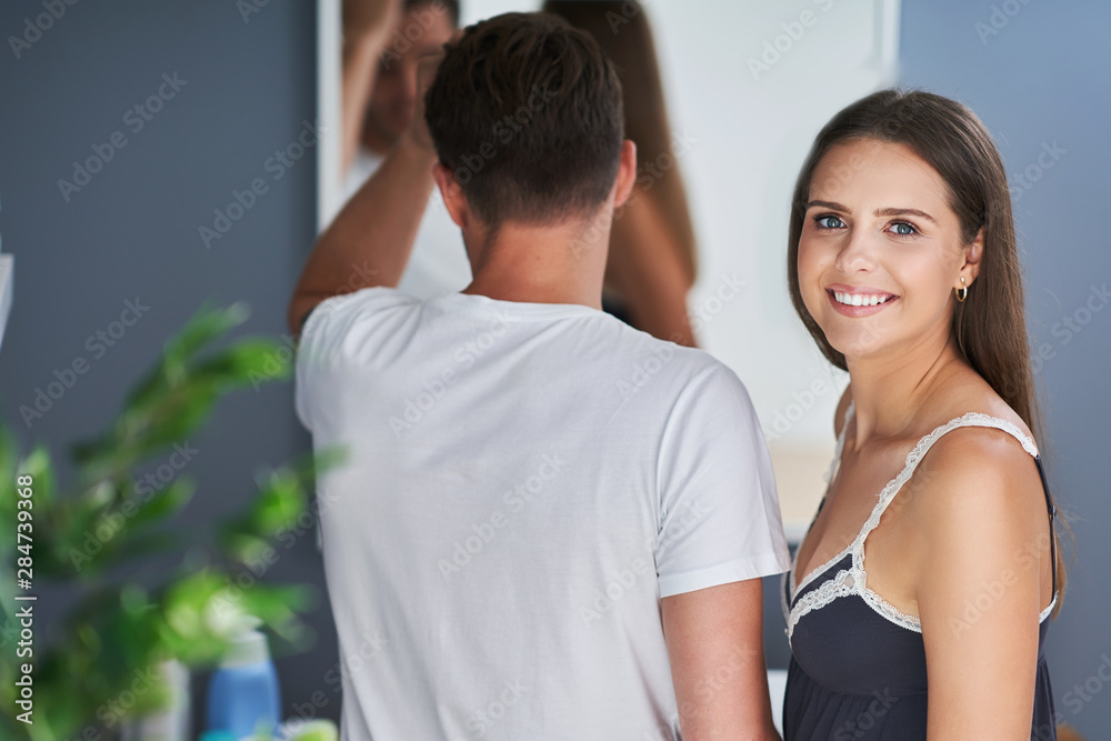 Portrait of happy young couple cuddling in the bathroom Portrait of happy young couple cuddling in the bathroom