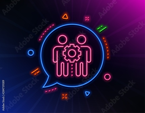 Employees teamwork line icon. Neon laser lights. Collaboration sign. Development partners symbol. Glow laser speech bubble. Neon lights chat bubble. Banner badge with employees teamwork icon. Vector