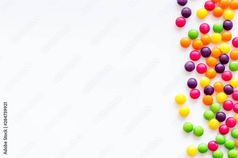 Assorted sweets and dots on white background top view space for text