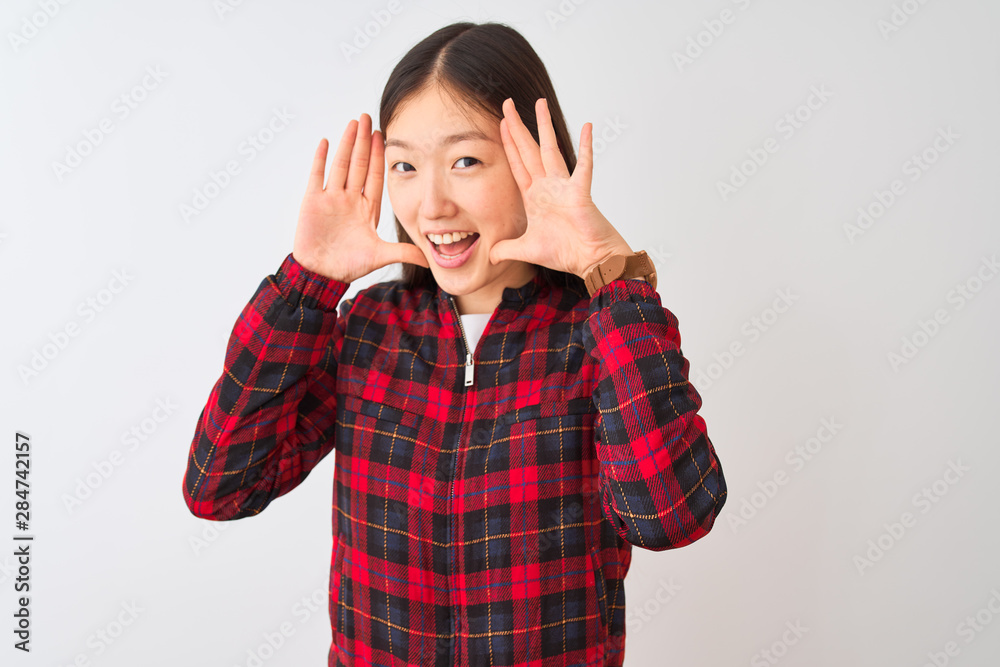 Young chinese woman wearing casual jacket standing over isolated white background Smiling cheerful playing peek a boo with hands showing face. Surprised and exited Young chinese woman wearing casual jacket standing over isolated white background Smiling cheerful playing peek a boo with hands showing face. Surprised and exited