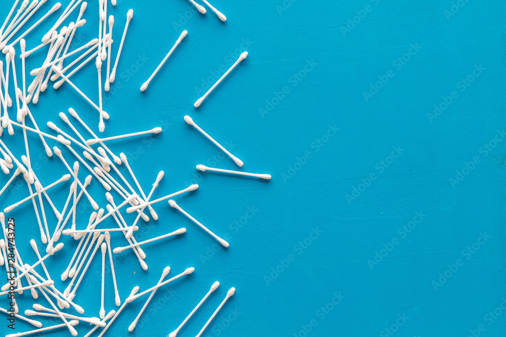 Hygiene cotton swabs for pattern on blue background top view mockup Hygiene cotton swabs for pattern on blue background top view mockup