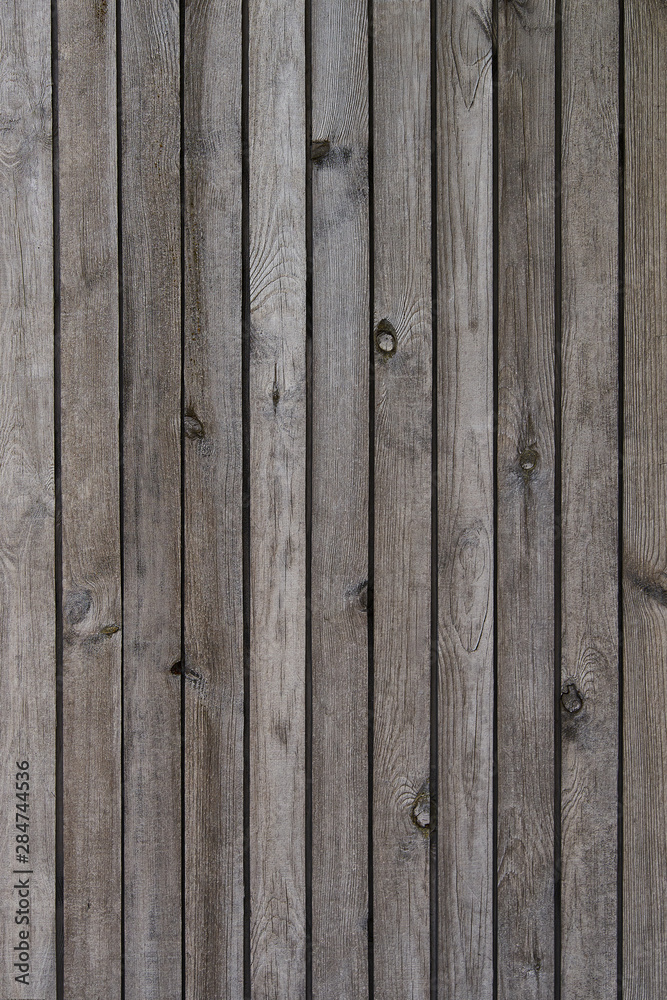 Naklejka premium Old grey wooden texture background. Vertical arrangement.