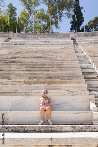 Girl sitting at the Panathenaic Stadium