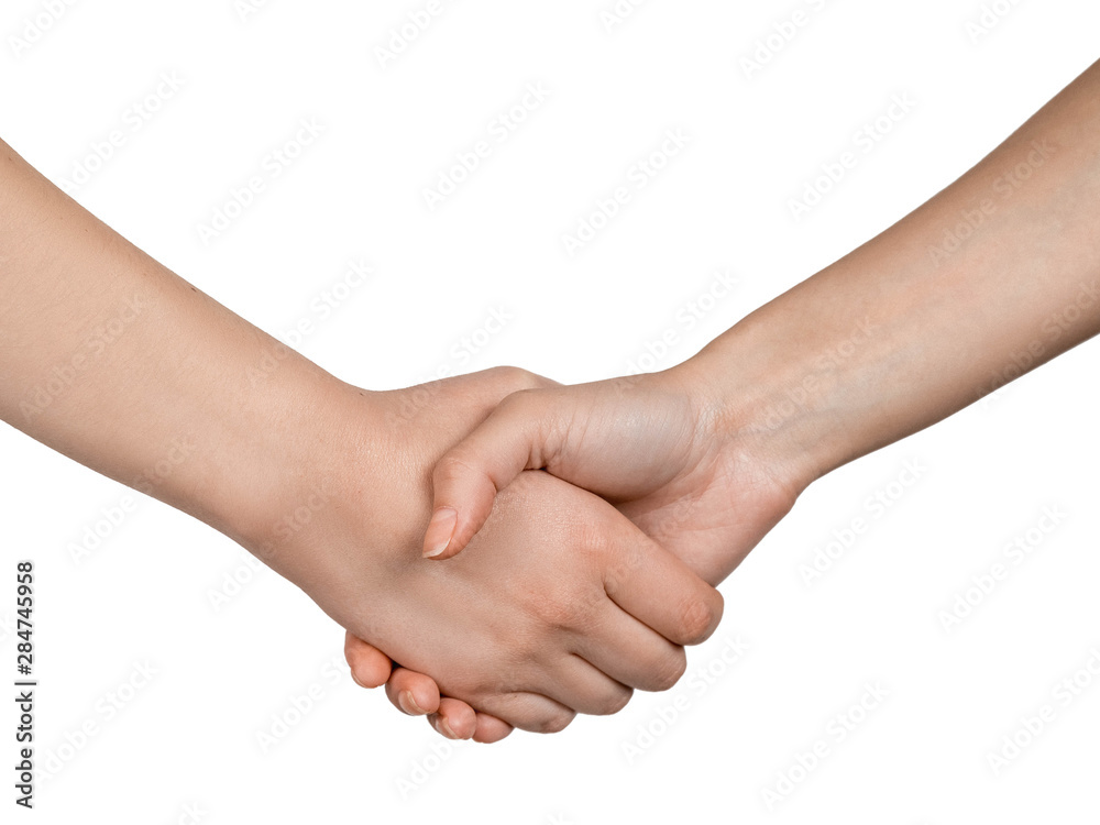 Two caucasian women's hands extended to meet each other in a handshake on a white background Two caucasian women's hands extended to meet each other in a handshake on a white background