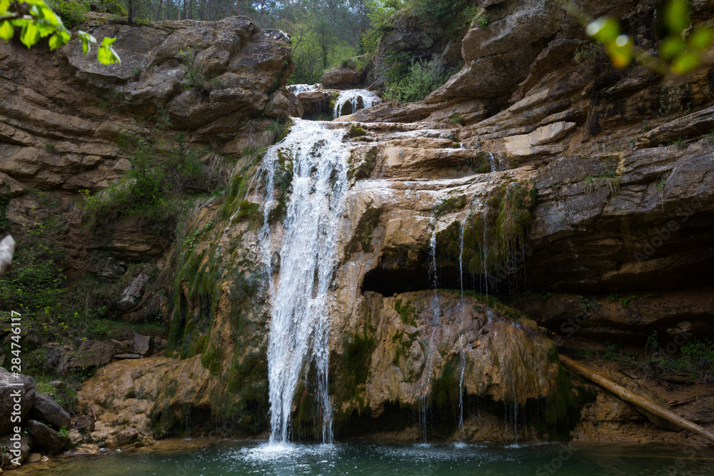 Fototapeta premium Waterfall in Catalonia surrounded by beautiful forests