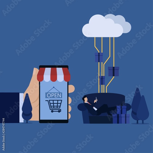 Businessman lay on sofa hold phone and hand hold phone market metaphor of online shopping.