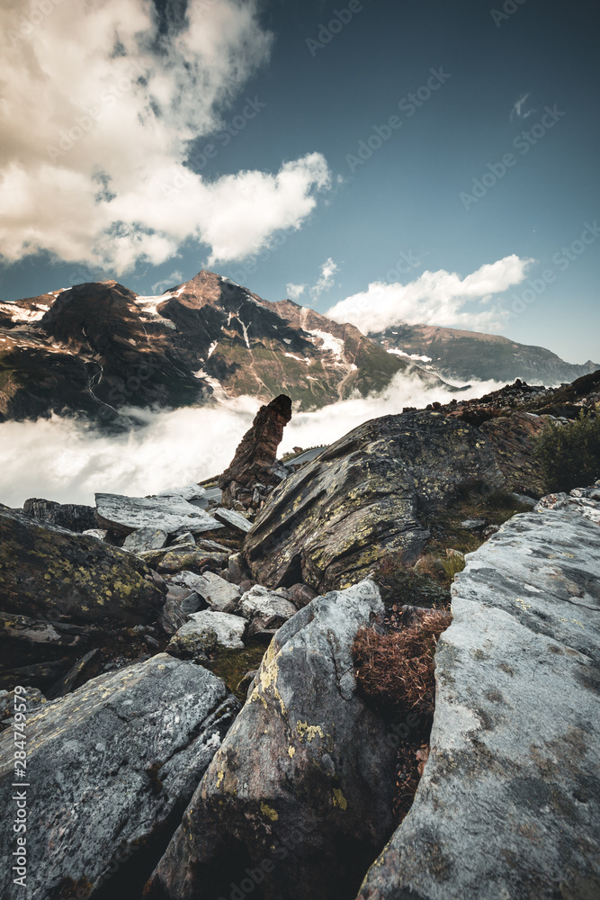 alpine landscape with peaks covered by snow and clouds in the alps in austria