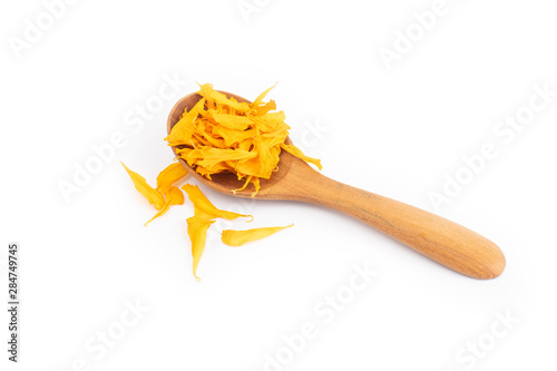 herbal calendula  in wooden sppon isolated on white background photo