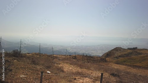 Mt. Ibuki summit, slow motion pan over wild countryside of Japan with lake Biwa in the distance 4k photo