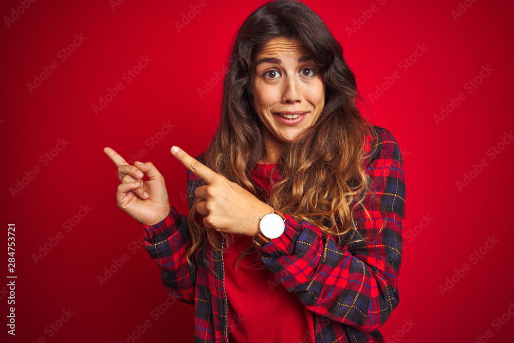 Young beautiful woman wearing casual jacket standing over red isolated background relaxed and smiling with eyes closed doing meditation gesture with fingers. Yoga concept. Young beautiful woman wearing casual jacket standing over red isolated background relaxed and smiling with eyes closed doing meditation gesture with fingers. Yoga concept.