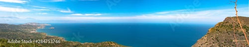 Beautiful panoramic view of the Aegean sea. Near to Sitia and Agios Nikolaos. Landscape with turquoise sea, mountains and green nature.