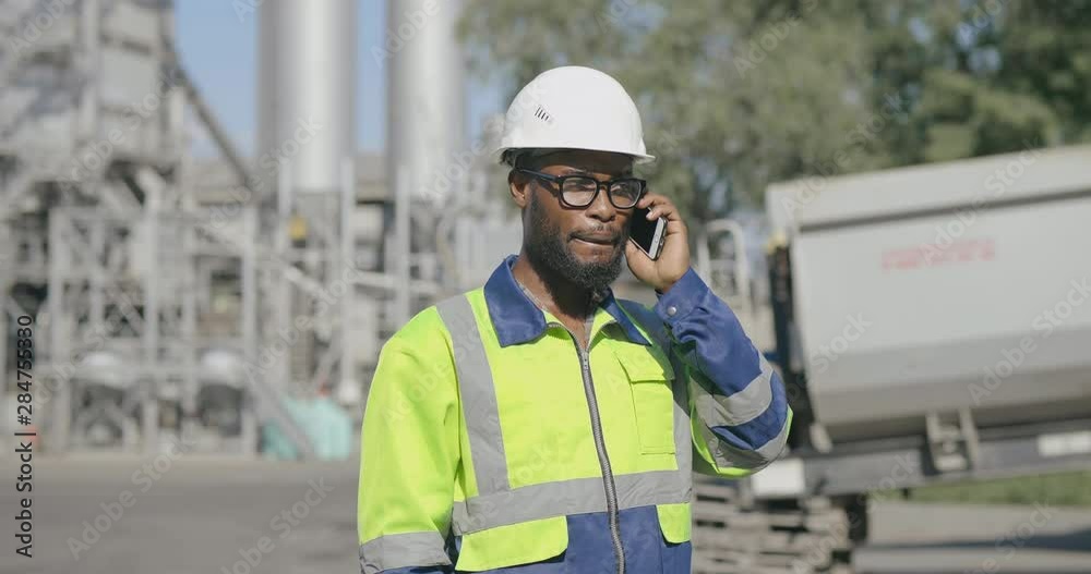 Portrait of an engineer talking on the phone Portrait of an engineer talking on the phone