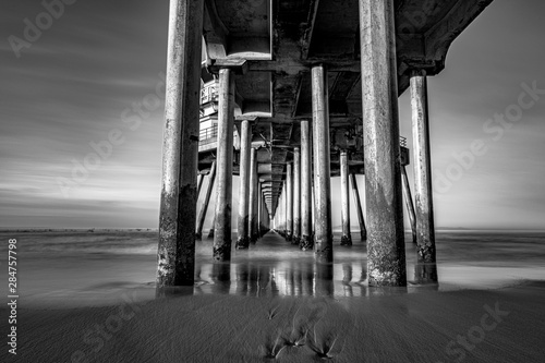 Under the pier.