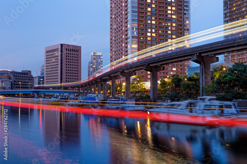 The light trace of the Tokyo monorail and a boat. © Yarema