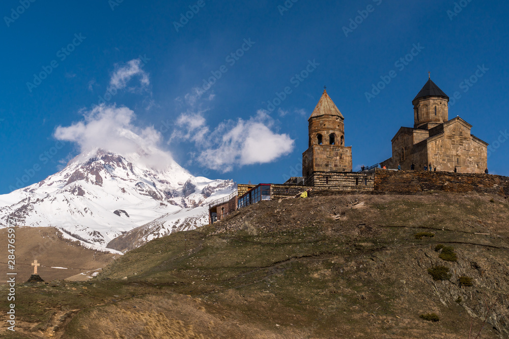 View of the Trinity Church on the background of Kazbek