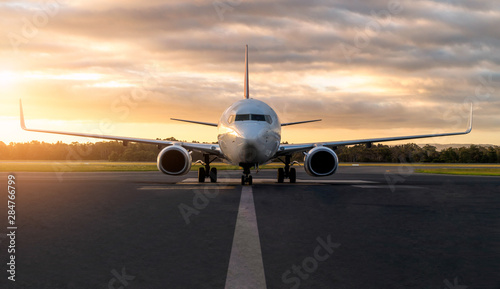 Konstfotografi Sunset view of airplane on airport runway under dramatic sky in Hobart,Tasmania, Australia
