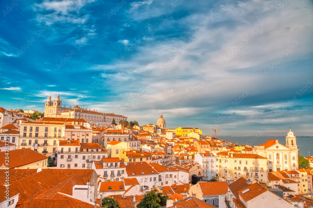 Scenic Alfama lookout with San Vicente (Saint Vincent) statue and Sao Vicente de Fora a church on the background