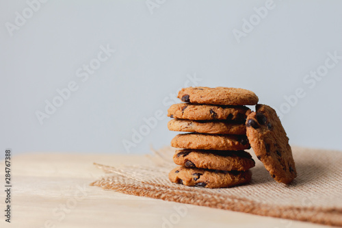 Chocolate chip cookies on brown background.