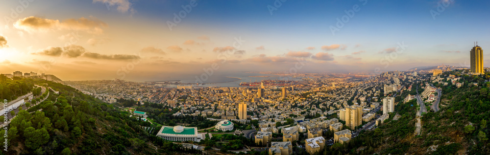 Aerial panoramic view of downtown Haifa with the port and harbor, Bat Galim and Hamoshava hagermanit in Israel before sunset