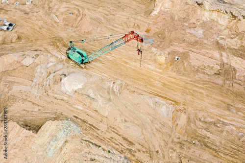 industrial crawler crane at large road construction site. aerial view