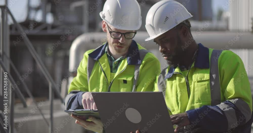 Industrial workers designing new project