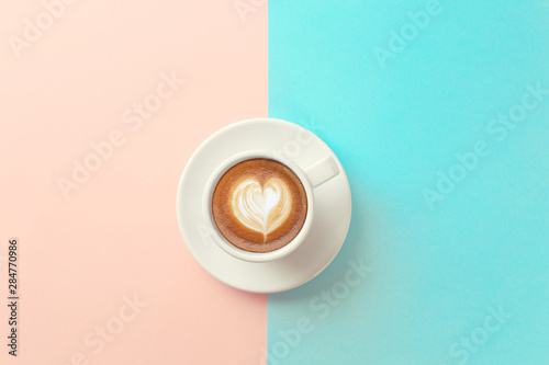 cup of coffee on blue and orange background