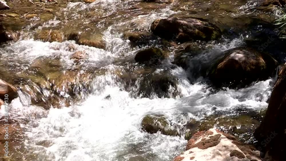 water flowing over rocks river stone water flowing over rocks river stone