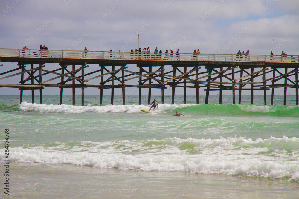 Surfers at Pacific Beach Pier California