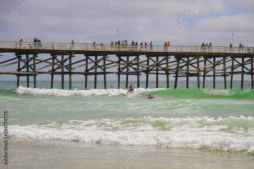 Surfers at Pacific Beach Pier California