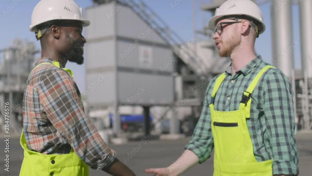 Engineer and inspector shaking hands Engineer and inspector shaking hands