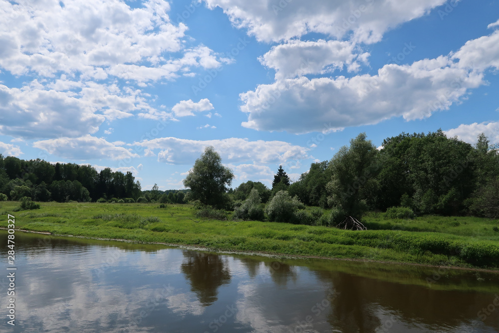 Picturesque river, fields and forest landscape. Russia