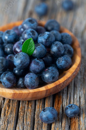 fresh blueberries in a wooden bowl