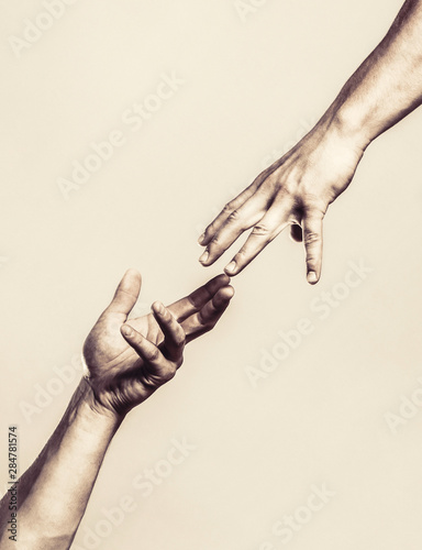 Two Hands Helping Arm Of A Friend Teamwork Helping Hand Outstretched Isolated Arm Salvation Close Up Help Hand Helping Hand Concept And International Day Of Peace Support Black And White Foto De Two Hands Helping Arm Of A Friend Teamwork Helping Hand Outstretched Isolated Arm Salvation Close Up Help Hand Helping Hand Concept And International Day Of Peace Support Black And White Foto De