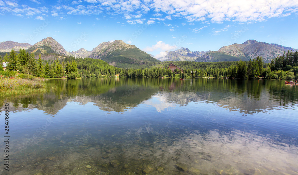 Reflection of mountain lake - Strbske pleso, Slovakia landscape