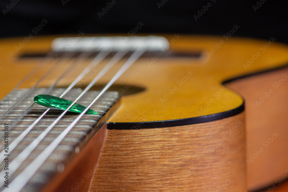 Fototapeta premium Guitalele with pick