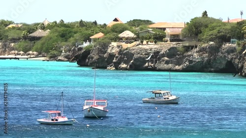 Curaçao Westpunt, Playa Forti, medium wide shot fishing boats, shore and houses photo