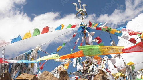 Prayer flags at Boudhanath Stupa in sunrise lights Buddhist colorful prayer flags blow by the wind in the mountains in slow motion