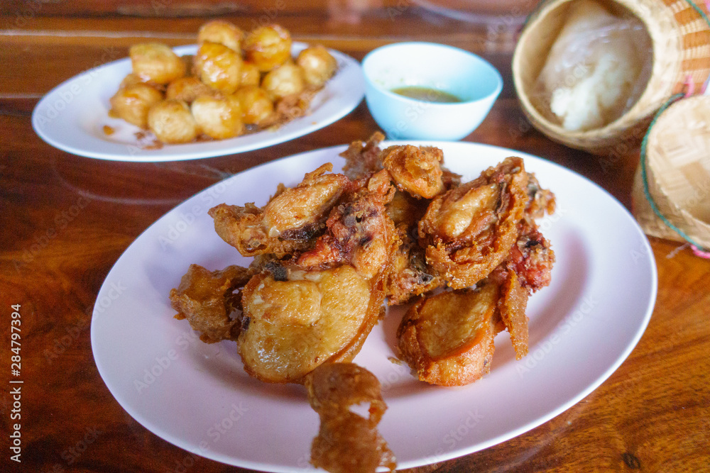 Special thai food fried chicken on wooden table. Special thai food fried chicken on wooden table.