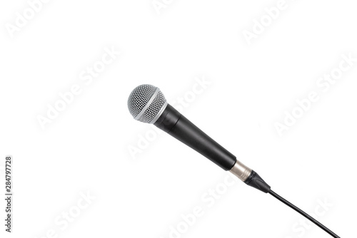 High fidelity microphone on white background with clipping path.Close up of high quality dynamic microphone connect with male xlr connector and  cable isolated on white background,top view. 
