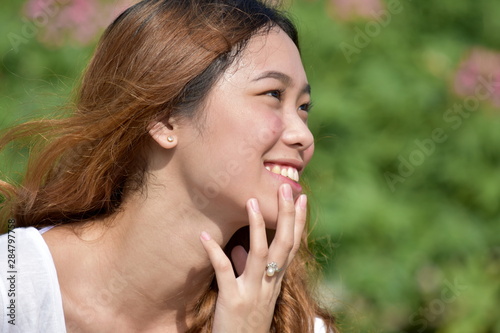 Contemplative Youthful Filipina Woman