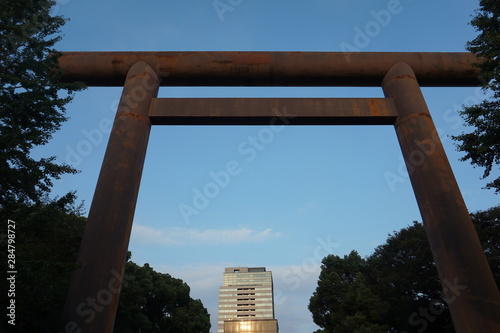 Torii traditional Japanese gate. Modern buildings in the background. History and modernity photo