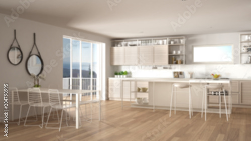 Blur background interior design  penthouse minimalist kitchen interior design  dining table  island with stools  parquet. Modern architecture concept idea