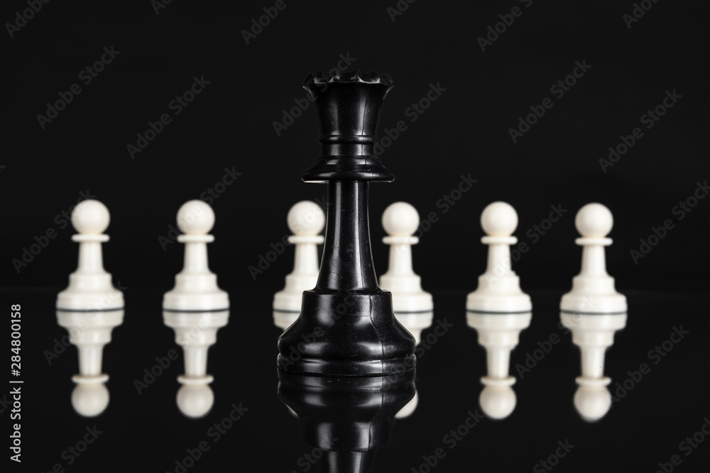 Chess figures on dark black background close up Chess figures on dark black background close up